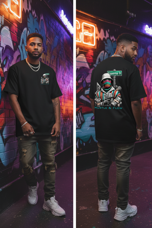 Man wearing a black t-shirt with a graphic design in front of a colorful mural.