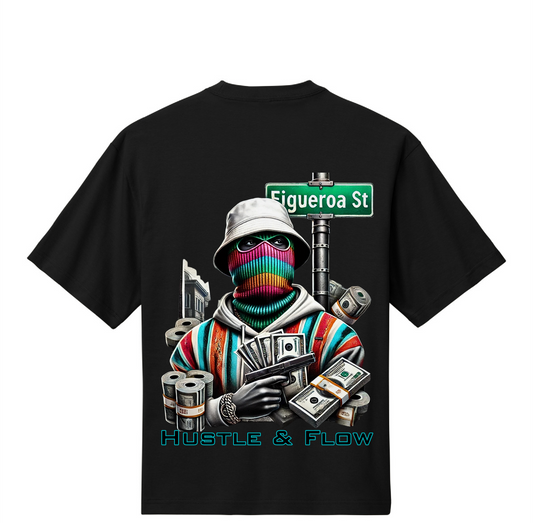 Black t-shirt with colorful graphic design featuring a character holding money and a cup, with 'Hustle & Flow' text on a white background.