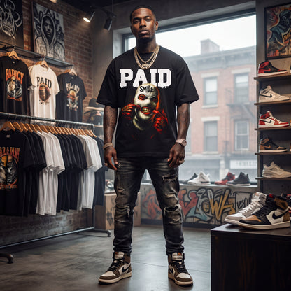 Man wearing a 'PAID' t-shirt in a store with clothing and shoes on display