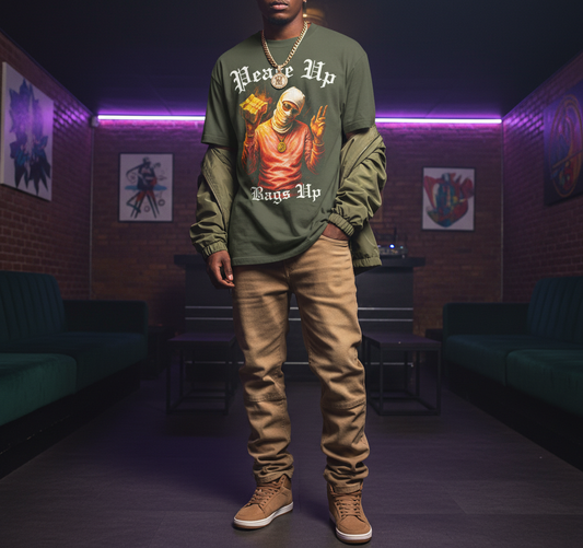 Person wearing a green sweatshirt with graphic design in a dimly lit room.